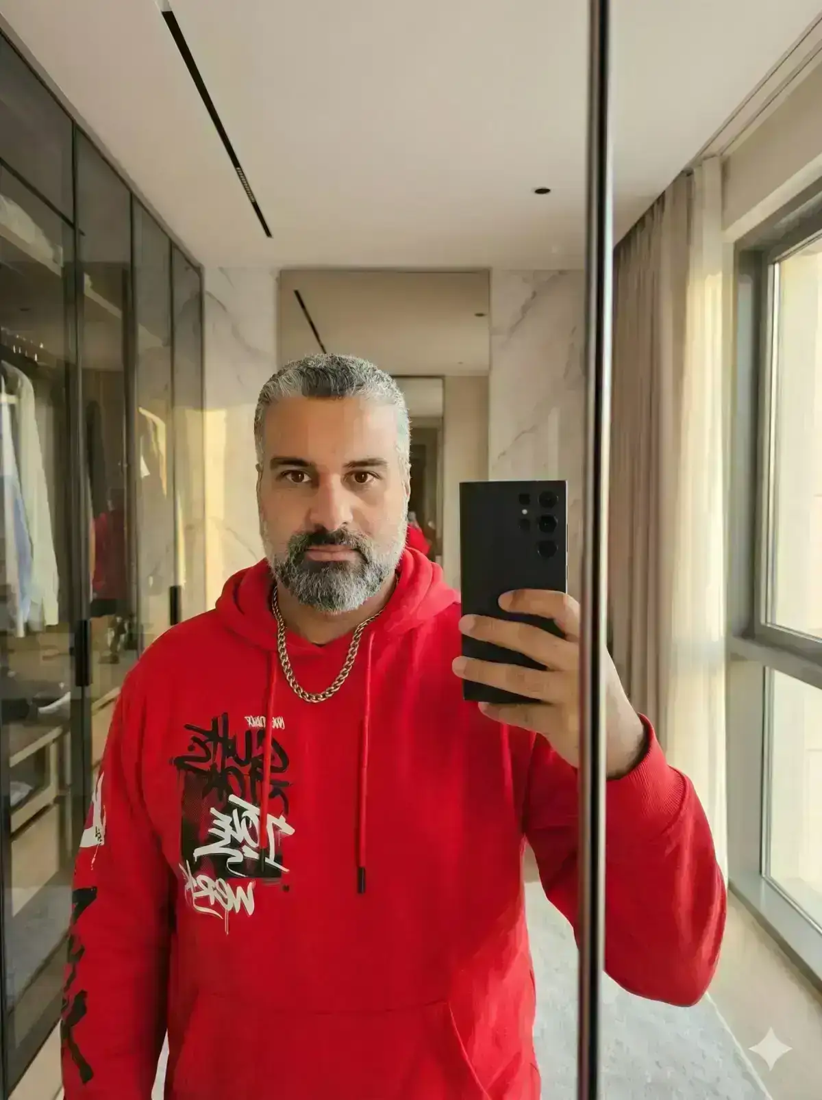 hyper-realistic natural photo of a young man taking a mirror selfie in a modern wordroom