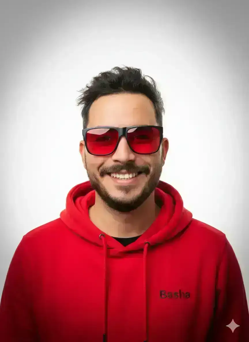 editorial portrait of a stylish young adult smiling man with messy hair