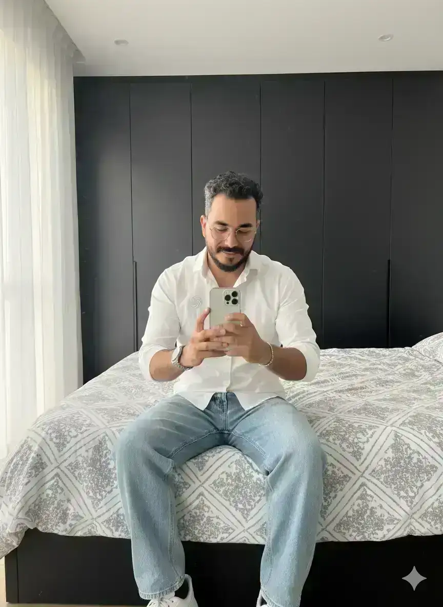 Casual mirror selfie in a modern bedroom